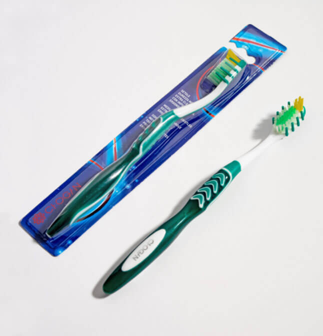 Extra clean medium bristle toothbrush